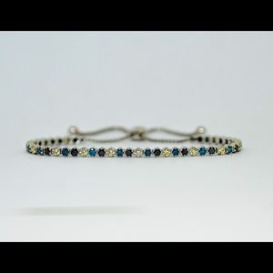14k White Gold Bracelet with 2.15 cttw Fancy Yellow, Black, and Blue Diamonds.